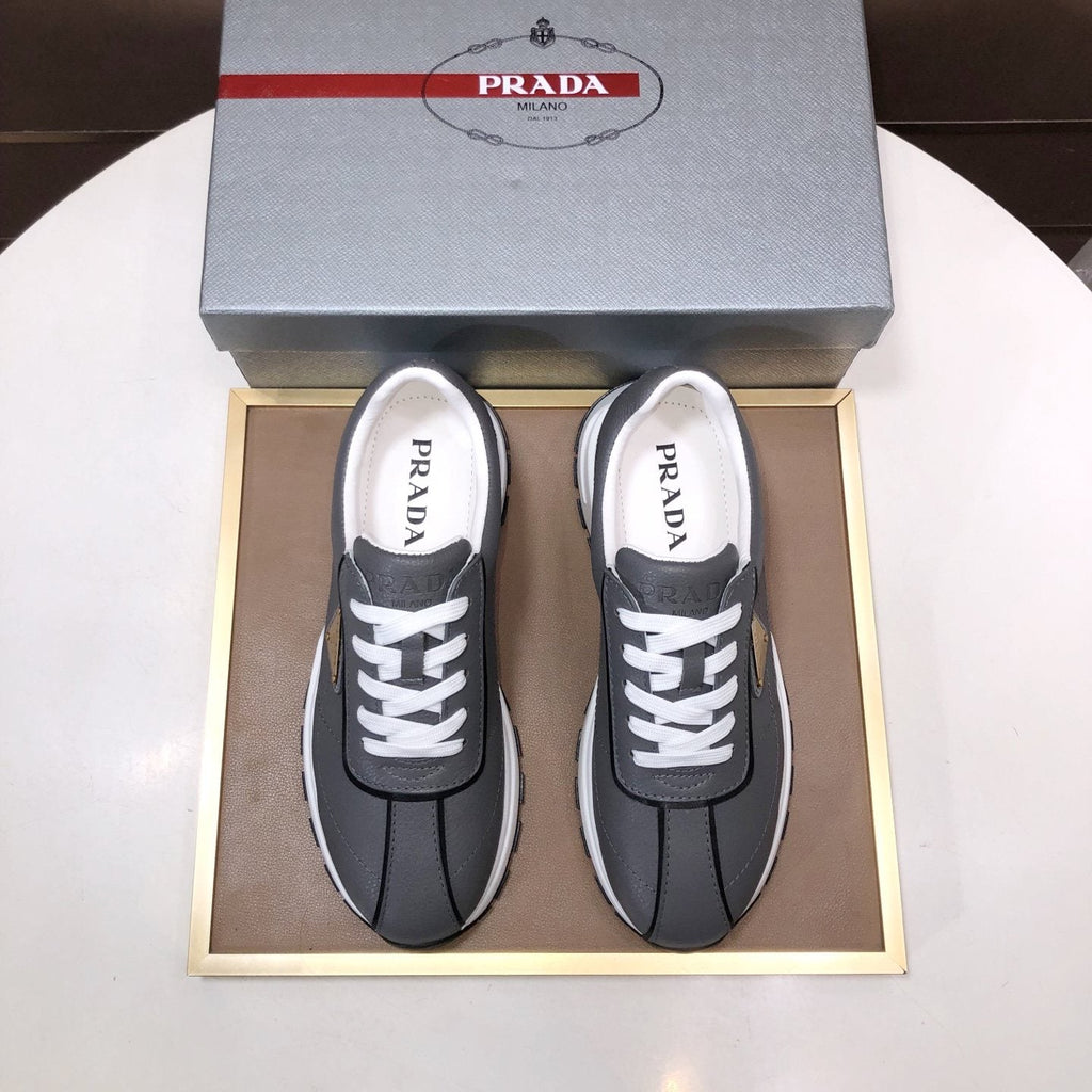 Prada Triangle Plaque Low-Top Sneakers - Triangular Side Plaque Detail